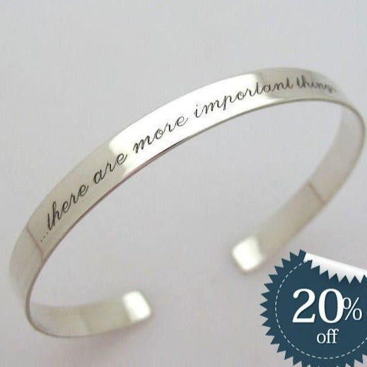 elegant silver cuff bracelet with the custom engraved message