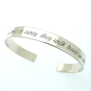 silver cuff bracelet with writing